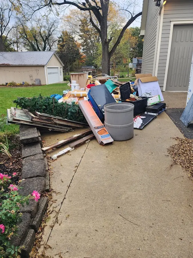 Dumpster being loaded with debris for Demolition Dumpster Rental in Fairfield Glade